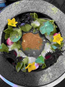 Hokkaido Scallop dressed with flowers and greens as served at RO restaurant & Lounge in Yountville, Napa Valley