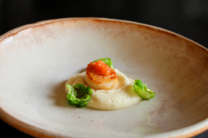 Seared Scallop from Chef Preeti Mistry's Chef's Table at Napa's Silver Oak Winery atop vanilla-infused parsnip puree